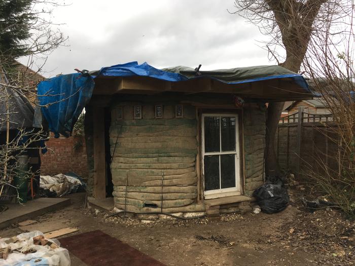 cob house with circular roof