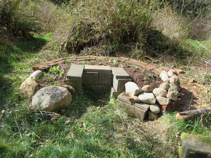 A remade garden! I didn't have enough bricks, so used rocks at the front of the garden