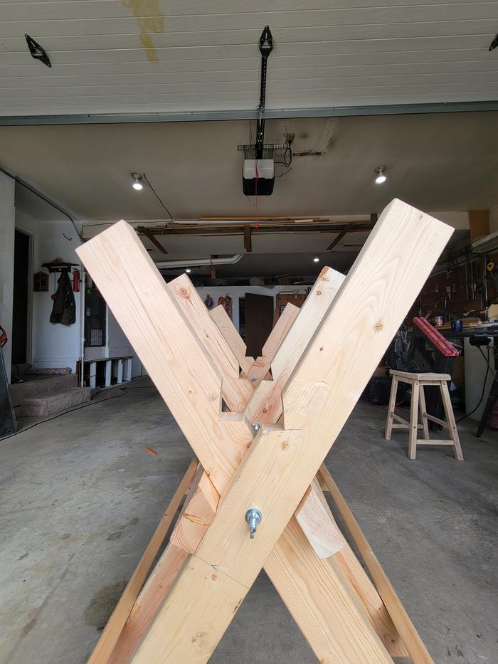 looking down the working end of a sawbuck with notches cut to hold dimensional lumber
