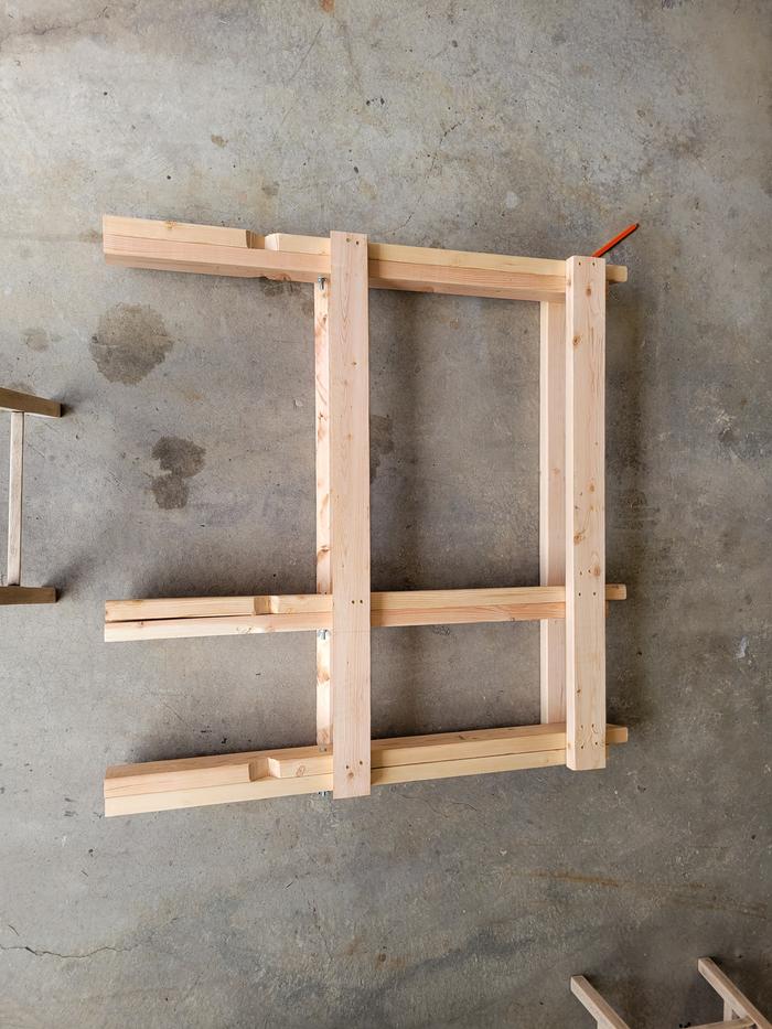 a sawbuck folded up and laid on the floor