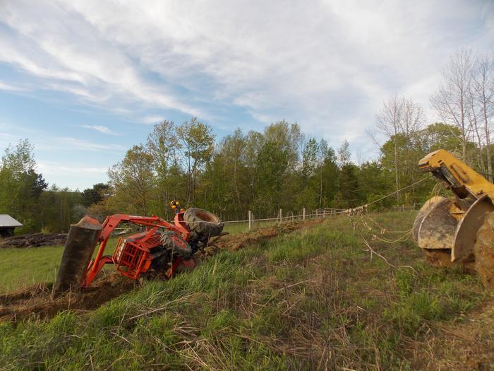 tractor being pulled upright