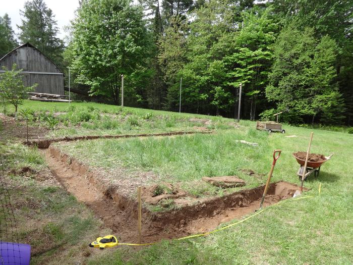 I think I'll put it here! Hand digging the trench.