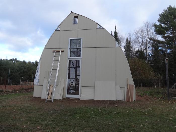 End walls covered with cement board. Those pieces get heavy when they're 15' off the ground