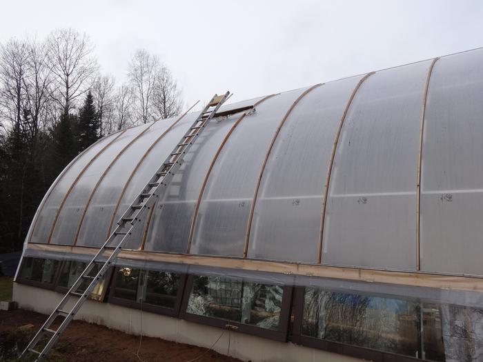 Here's how I got up there to put the cedar spacers on. Lower vents (reused patio doors) installed