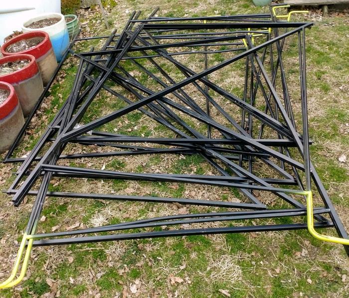 A stack of the rectangular rug racks I used for the sides of the arbors.