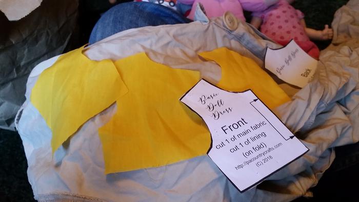 Yellow cloth already cut out, now cutting up old pants to make the lining