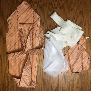 Deconstructed with lining, interfacing, and silk liling of tie point (on right)