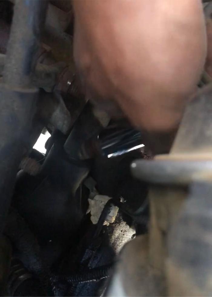 Blurry pic of removing an old spark plug.