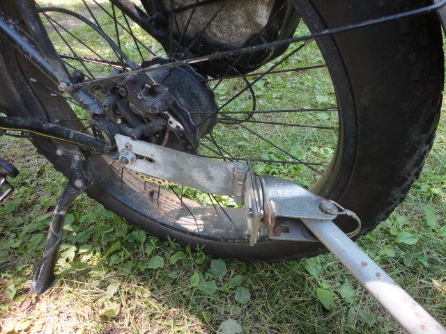 The hitch on the bike with the trailer arm attached.