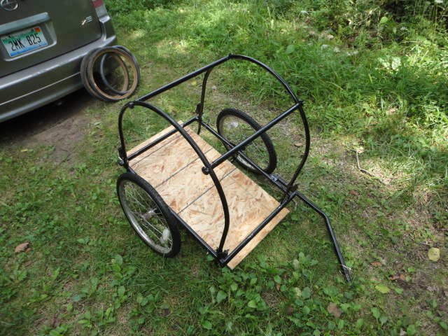 Here is the trailer with both new solid rubber tires installed.