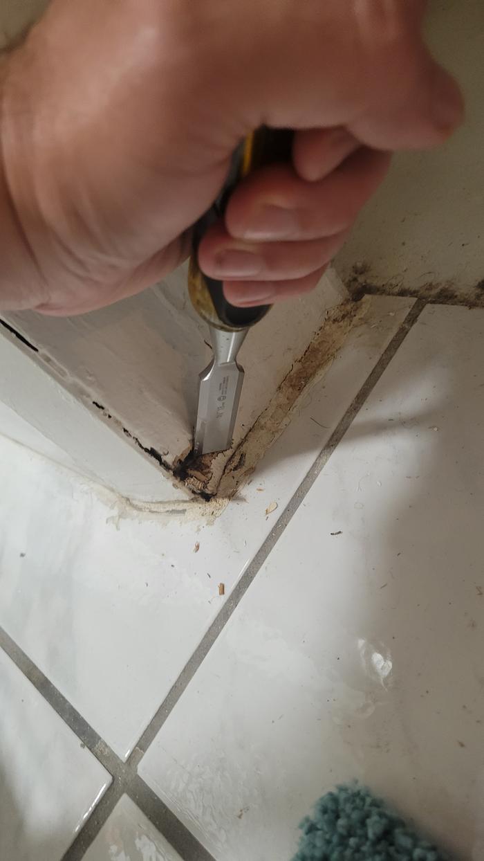 Chiseling rotted door frame