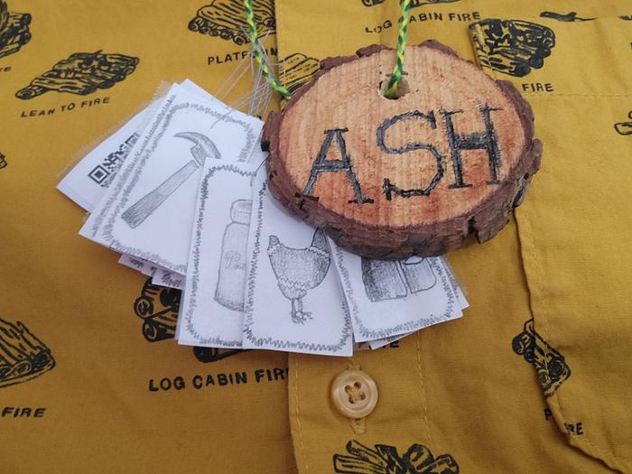 Closeup of finished name badge and PEP badges