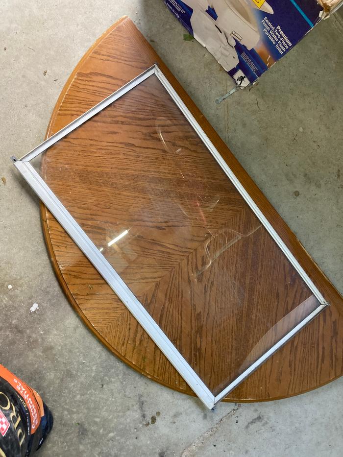 Old window glass to be cut and reused