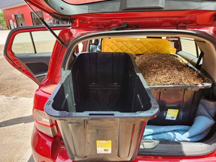 totes squeezed into little hatchback