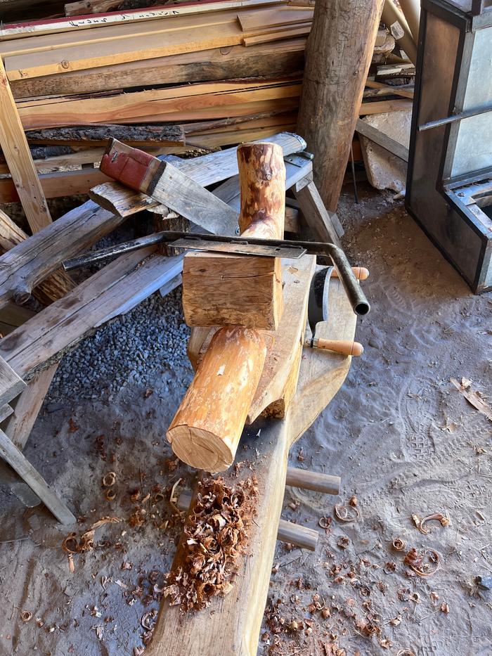 Peeling on the shaving horse with a draw knife 