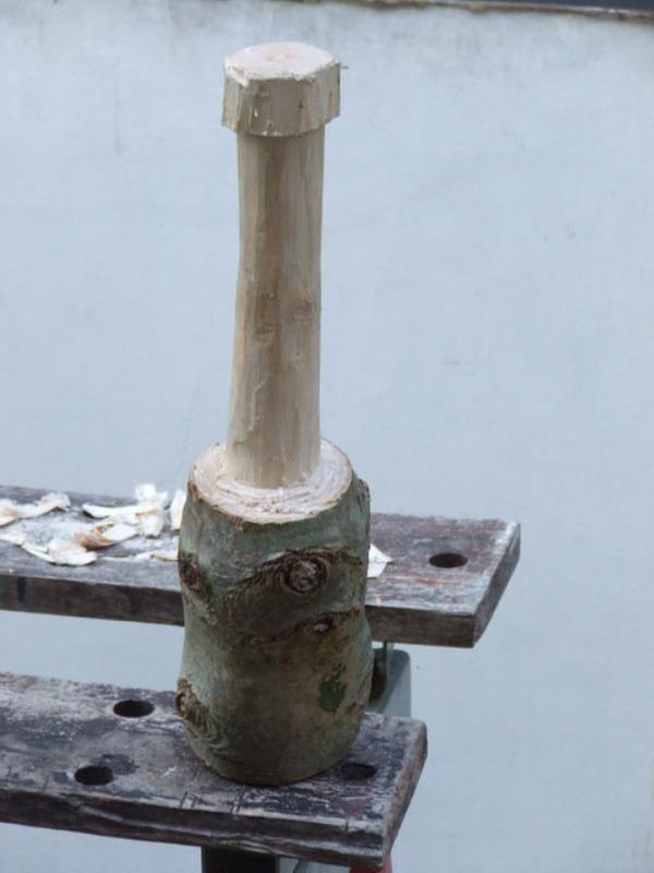 green wood carved mallet