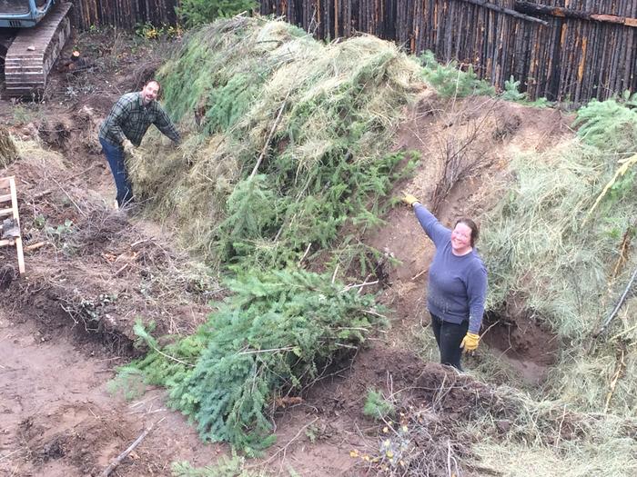 Opalyn pointing to my mulched section.