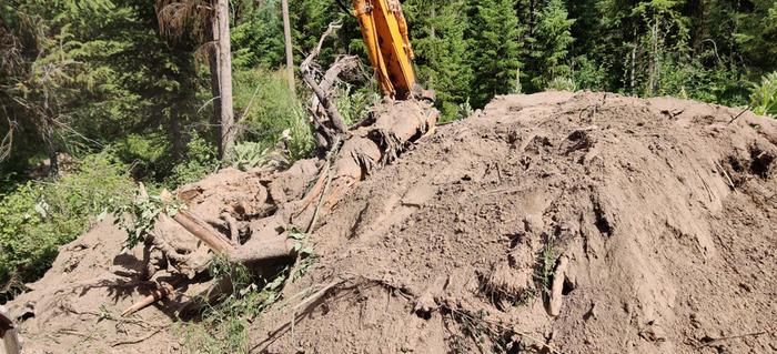 First layer of logs covered with dirt