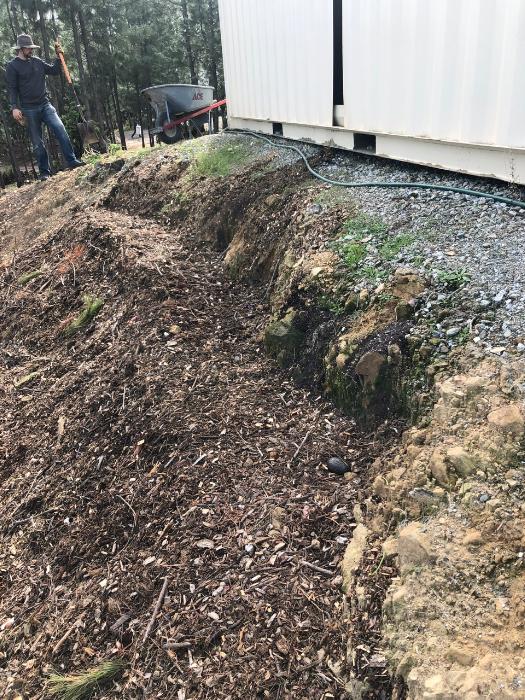 Covered the food scraps in more mulch and smoothed it out. 