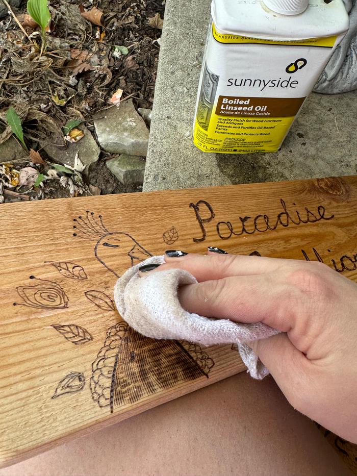 sign getting oiled with boiled linseed oil