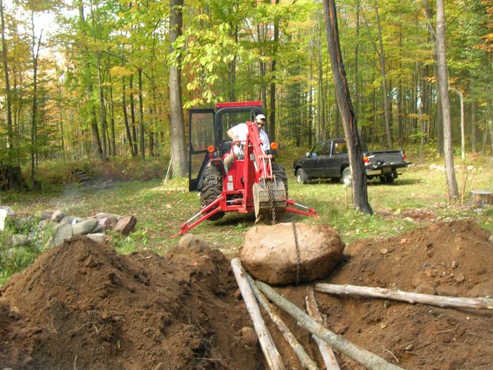 Still not sure why I didn't dig a hole next to it for the boulder instead of pulling it out... Stump on the right.