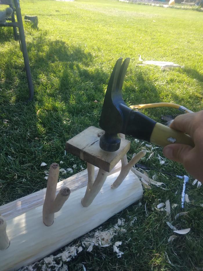 pounding the pegs in for a tighter fit