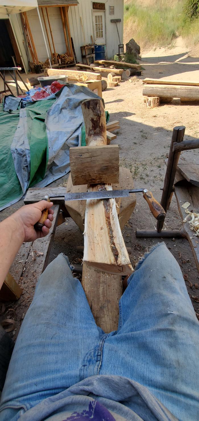 shaving the log down flat, this took a while