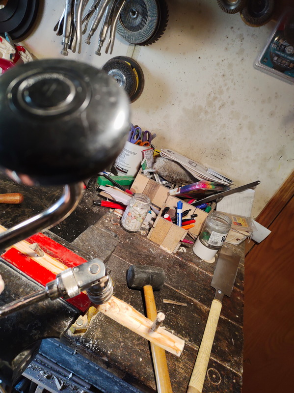 Bored peg holes with a hand crank drill. 