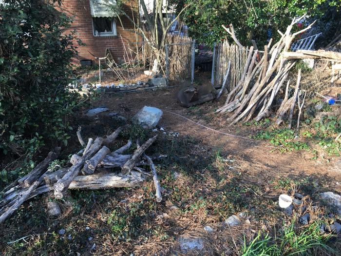 stockpile of smaller rot resistant poles. 2 legs are chestnut, 1 is b. locust